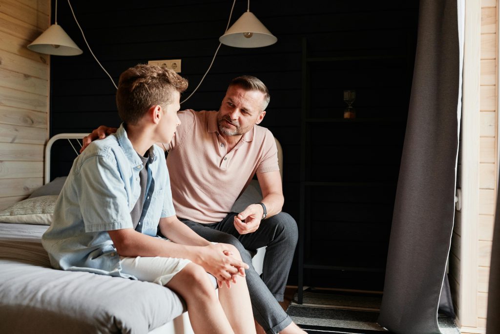 Father having a serious discussion with his son